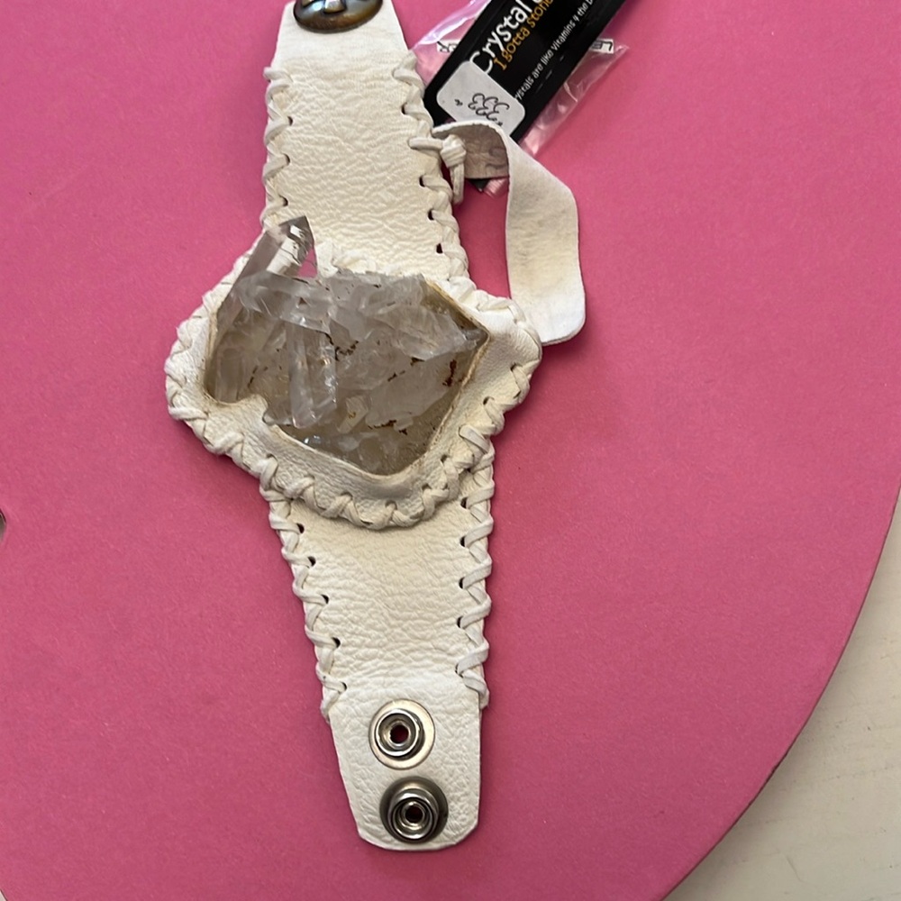 White leather bracelet with quartz crystals.